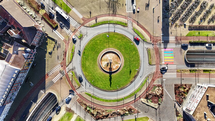 Road ring junction with bike paths and pedestrian crossings aerial drone view from above, urban transportation, Venlo, the Netherlands