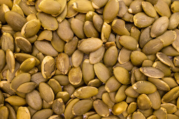 dry pumpkin seeds close-up background