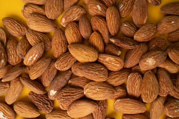 Warm brown hues of the almond nuts. Food concept. Almond pattern concept