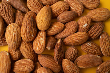 Warm brown hues of the almond nuts. Food concept. Almond pattern concept