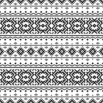 Aztec-inspired seamless pattern with bold geometric squares. Black and white tribal motif, perfect for textile prints, backgrounds, and graphic design projects