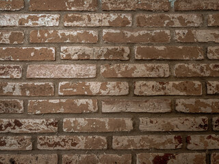 Old brown brick wall, old texture of red stone blocks closeup. For background.