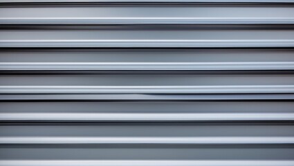 Obraz premium Metallic gray textured background with horizontal lines and shadows from a rolling shutter system or similar architectural feature