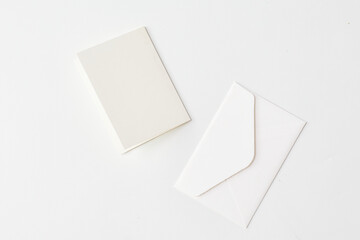 Minimalist Blank Notebook and Envelope on White Background Ready for Writing and Correspondence