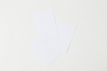 Blank Cards Scattered on a White Surface for Creative Projects and Brainstorming Activities