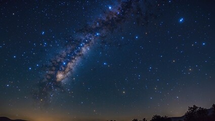 Fototapeta premium Starry night sky with galaxy and bright stars over a dark landscape natural astronomy scene 28035