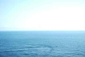 landscape of horizontal calm blue sea with wave and cloud and blue sky in bright day. Vacation and travel destination summer of ocean in Bali, Indonesia