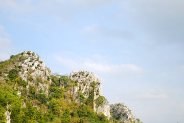 landscape rocky mountain and forest on hill with cloud and blue sky in Thailand. Copy space
