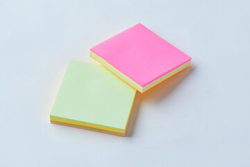 Colorful Sticky Note Pads Stacked on a Light Surface for Organization and Reminders
