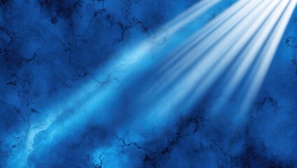 Vibrant abstract blue background featuring dramatic rays of light creating a serene and tranquil atmosphere for various design applications.