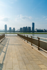 Fototapeta premium City square platform and panoramic view of the city