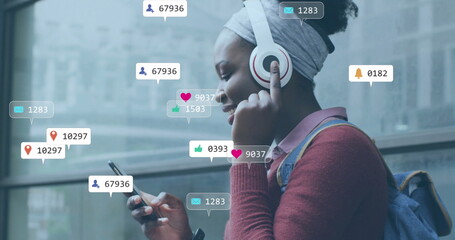 Image of icons and data processing over african american woman using smartphone