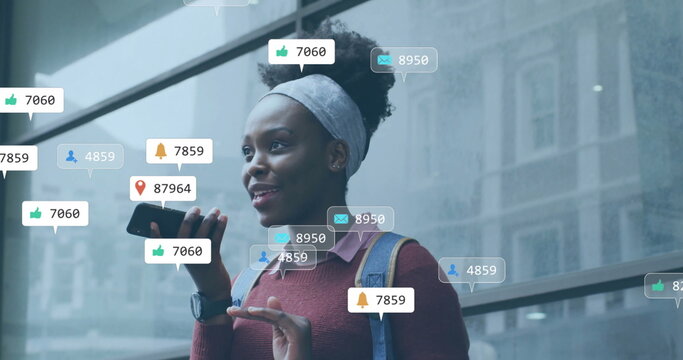 Image of icons and data processing over african american woman using smartphone