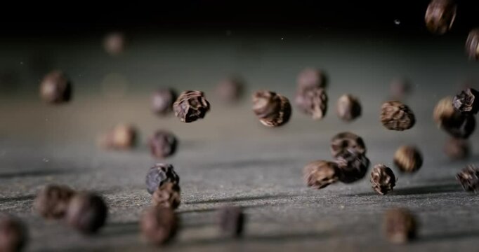 Peppercorns or black pepper spice. Super Macro Close Up. Shot on super slow motion camera 1000 fps.