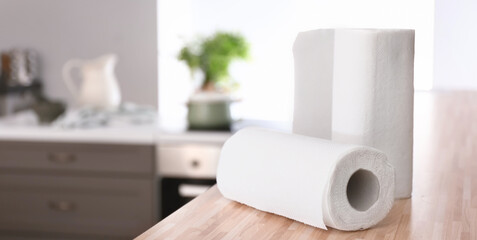 Rolls of paper towels on kitchen table