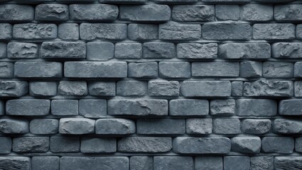 Obraz premium Dark textured stone wall with irregularly shaped gray bricks arranged in a stacked formation