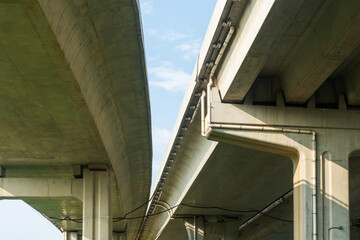 Elevated expressway during a sunny day. highway overpass against blue sky