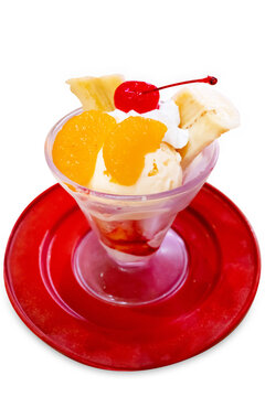 Top view of parfe Fruit ice cream on red plate, focus selective
