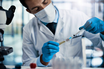 Healthcare, injection and hands of man with needle, drug and research for antivenom in hospital. Face mask, syringe and doctor with vial, medical innovation and venom examination for biotechnology