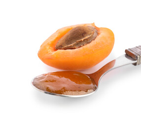 Spoon with sweet apricot jam on white background