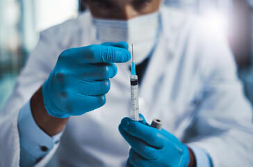 Healthcare, science and hands of man with syringe, drug and research for antivenom in hospital....