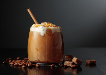 Iced coffee with whipped cream and caramel sauce.