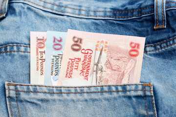 Gibraltar pound  in the pocket of blue jeans