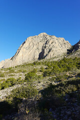 The mountain panorama opening from the hiking path to Puig Ca Campana, Finestrat, Spain  