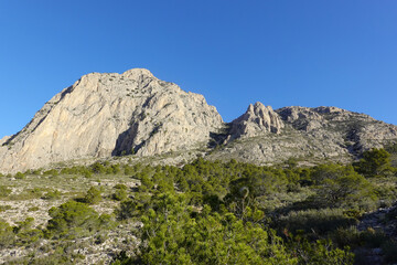 The mountain panorama opening from the hiking path to Puig Ca Campana, Finestrat, Spain  