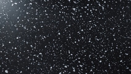 Obraz premium Black speckled granite texture with white and gray flecks suitable for backgrounds or surfaces in design projects.