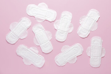 Menstrual pads on pink background