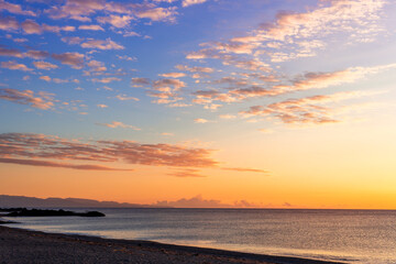 scenic view at beautiful morning beach coastline with orange sand, blue sea water of gulf and beautiful cloudy sky. Nature landscape of wallpaper and backgeound