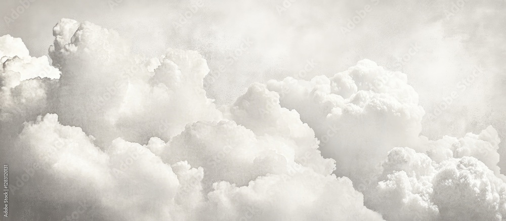 Aufkleber Soft billowing white clouds with a grayish tint fill the sky, creating a tranquil and serene atmosphere in the upper half of the image.