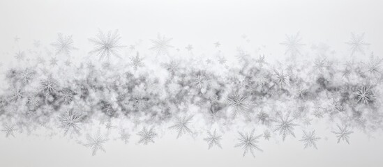Obraz premium Abstract monochrome background featuring soft gray and white star-like shapes scattered horizontally across a light gray canvas.