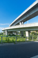 Concrete structure and asphalt road space under the overpass in the city