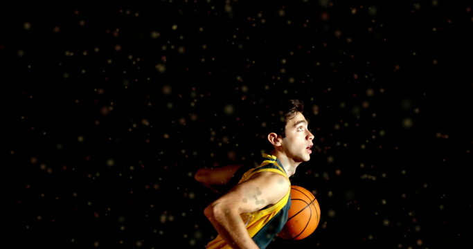 Image of moving spots over biracial male basketball player playing basketball - Powered by Adobe