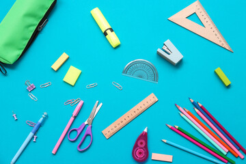 Different stationery on blue background. Top view