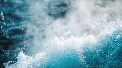 A close-up shot of a wave crashing against the ocean surface, with sea spray and foam visible