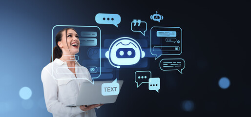 Woman using AI chatbot technology on laptop with holographic int