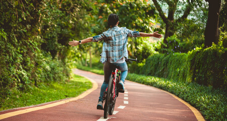 Woman enjoy the cycling in the park