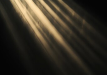 rays of light falling on a black background