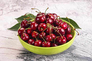 Red sweet cherry in the bowl