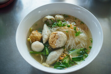 Fish line in white bowl, Fish ball noodle soup recipe. Top view