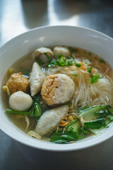 Fish line in white bowl, Fish ball noodle soup recipe. Top view