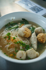 Fish line in white bowl, Fish ball noodle soup recipe. Top view