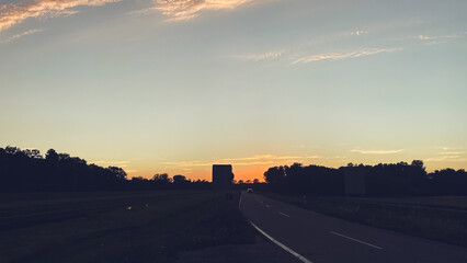 Road with a sunset in the background