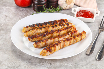 Grilled meat sausages wrapped bacon