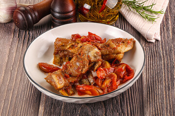 Baked lamb ribs with vegetables