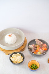 Delicious Beef Rib Soup Featuring Juicy Meat, Vegetables, Steamed Rice, Crispy Crackers, And Green Chilies For A Wholesome And Appetizing Dining.