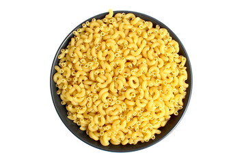 There is a black plate with dry pasta on a white background.